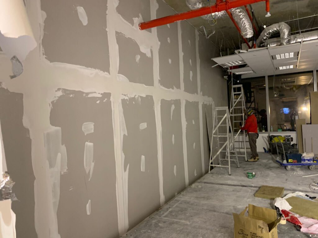 Intertenancy wall in progress Intertenancy wall in progress